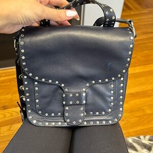 Rebecca minkoff navy crossbody top handle bag with grommet details